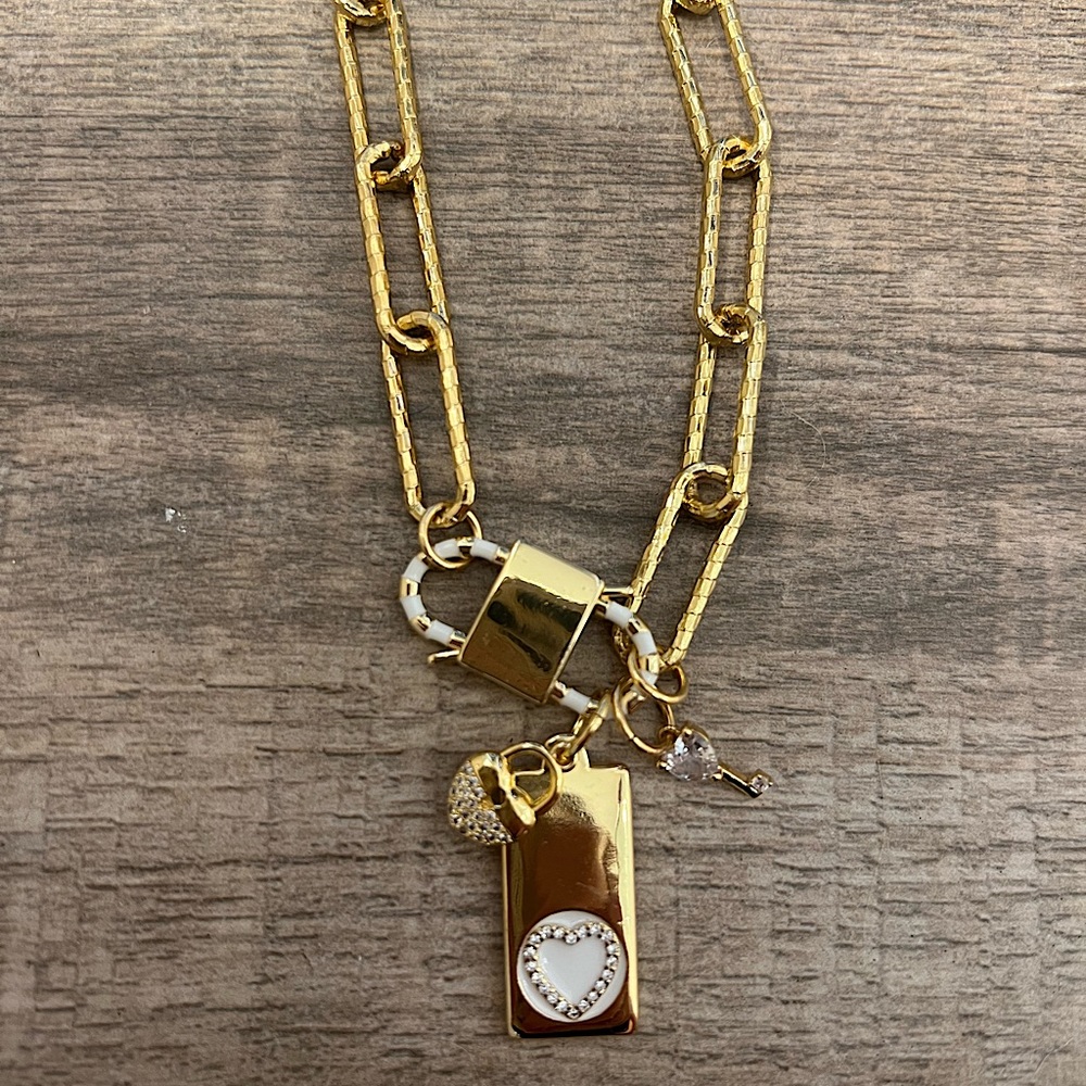 Melania Clara triple gold dipped heart with lock necklace